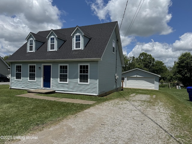 695 Johnson St, Leitchfield, KY 42754 - cape cod home with a detached garage, an outdoor structure, a front lawn, and roof with shingles