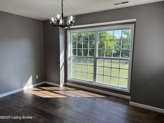 695 Johnson St, Leitchfield, KY 42754 - unfurnished dining area with a chandelier and dark wood-type flooring