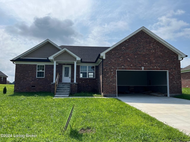 view of front of home with a garage and a front yard