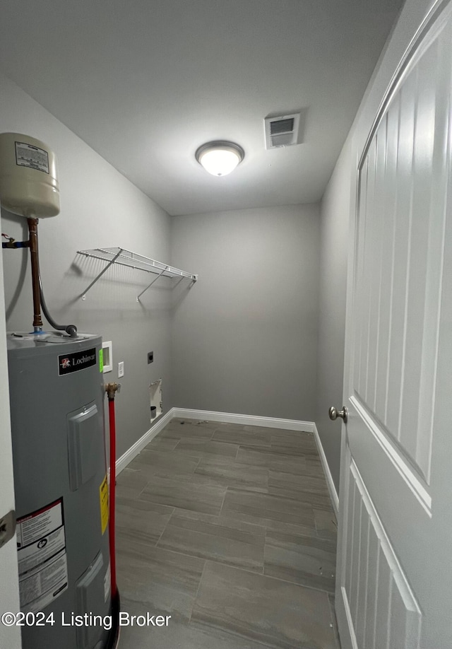 laundry room with electric water heater, hookup for an electric dryer, and hookup for a washing machine