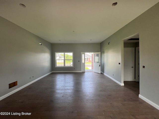 unfurnished room with dark hardwood / wood-style flooring