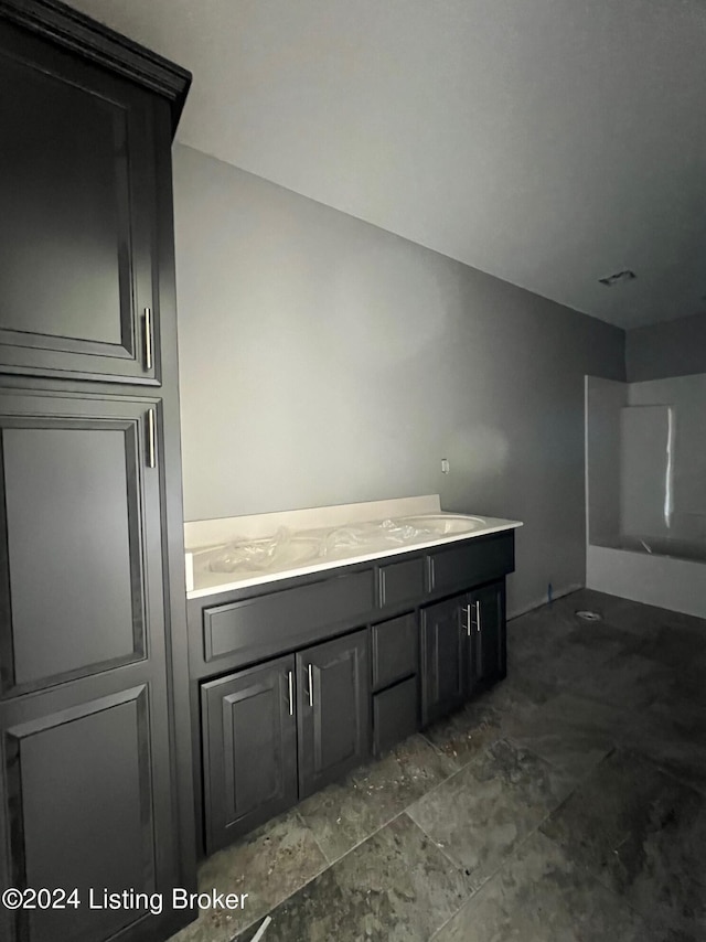 interior space with tile patterned floors and vanity