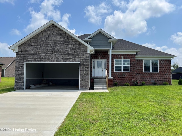 view of front of property with a garage and a front lawn