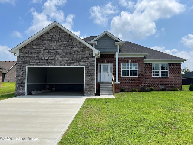 view of front of home with a garage and a front lawn