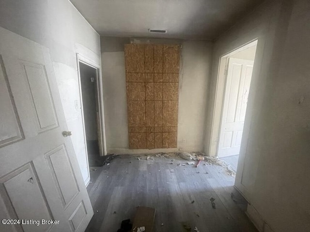 hallway with dark hardwood / wood-style floors