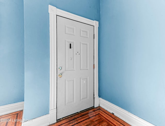 foyer with dark hardwood / wood-style flooring