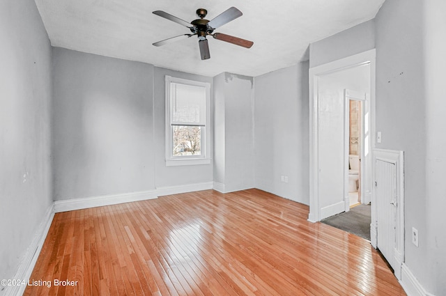 unfurnished room with ceiling fan and light hardwood / wood-style flooring