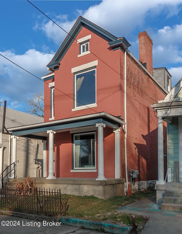 rear view of house with covered porch