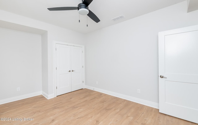 spare room with light hardwood / wood-style floors and ceiling fan