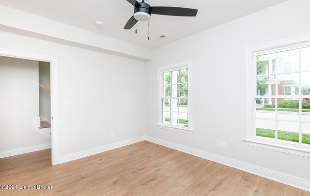 spare room with ceiling fan and light hardwood / wood-style floors