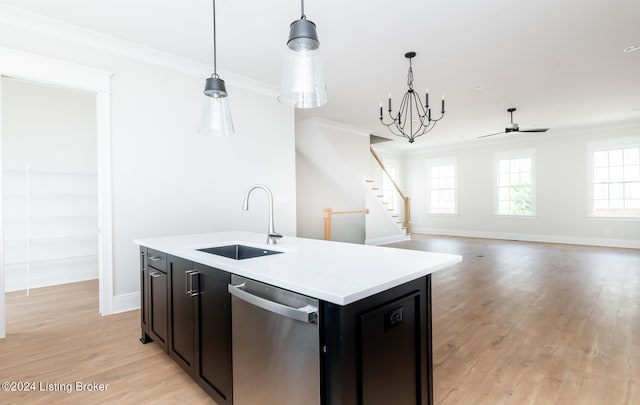 kitchen with light hardwood / wood-style flooring, an island with sink, stainless steel dishwasher, pendant lighting, and sink