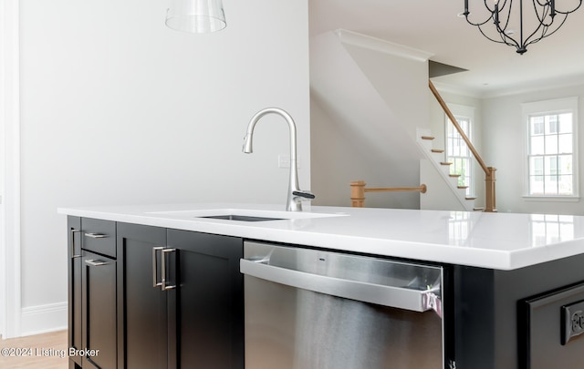 kitchen with light wood-type flooring, dishwasher, decorative light fixtures, sink, and ornamental molding