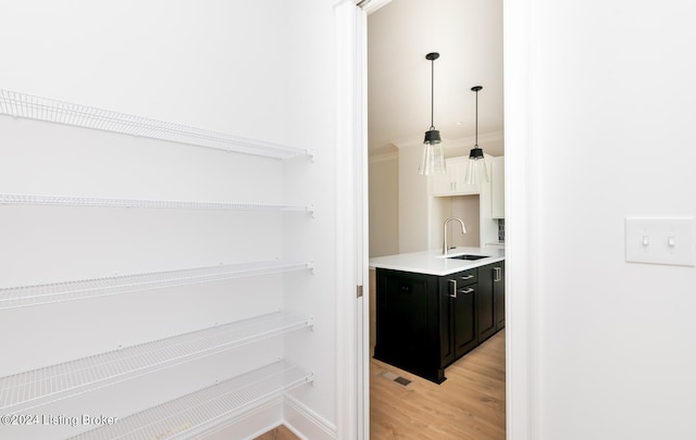 interior space featuring sink and light hardwood / wood-style floors