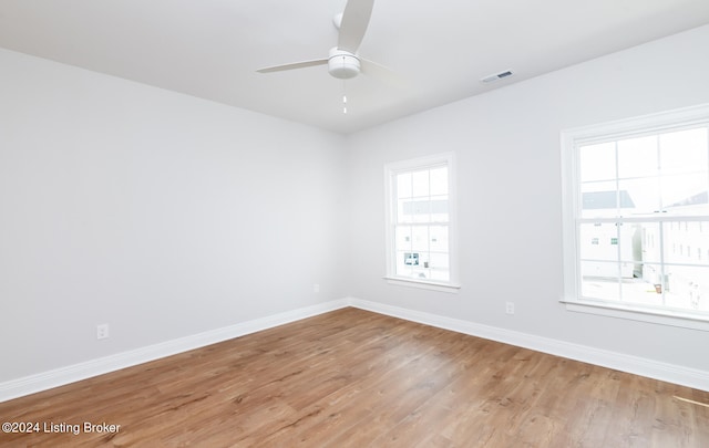 unfurnished room with light hardwood / wood-style flooring and ceiling fan