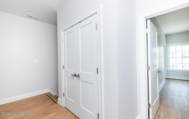 hall with light wood-type flooring