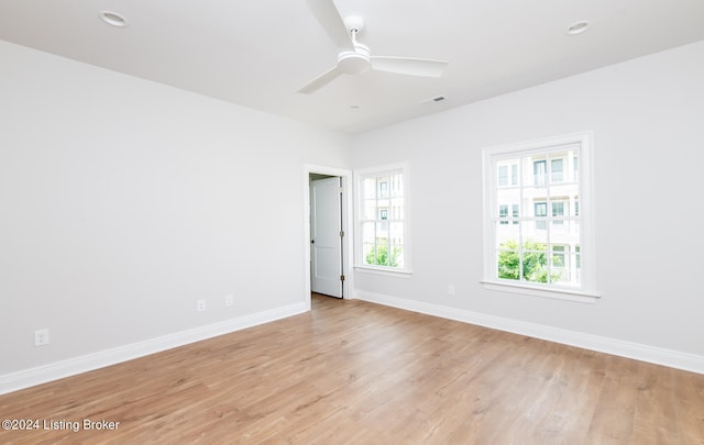 spare room with ceiling fan and light hardwood / wood-style flooring