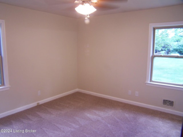 carpeted empty room with ceiling fan