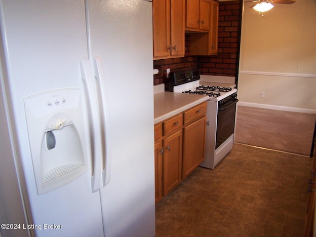 kitchen with ceiling fan, white appliances, and tasteful backsplash