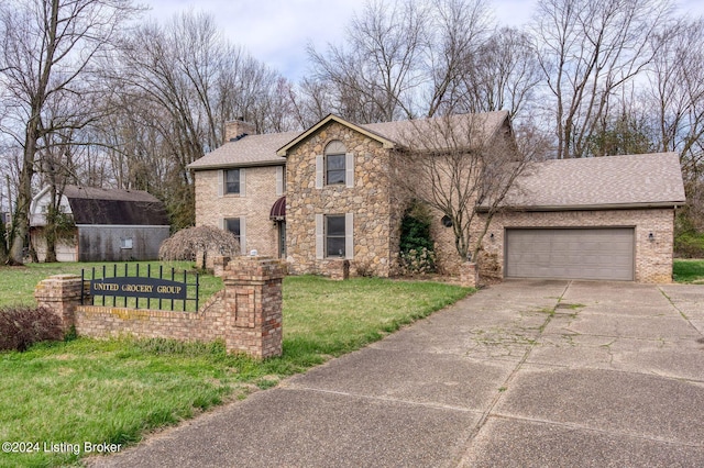 view of front facade featuring a front lawn and a garage