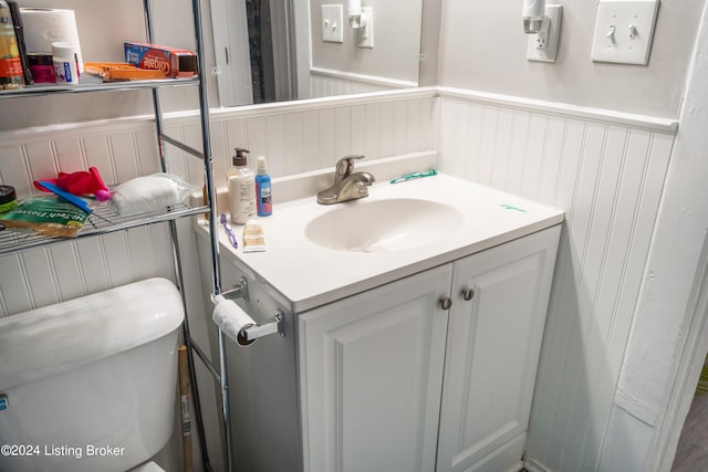 bathroom featuring oversized vanity and toilet