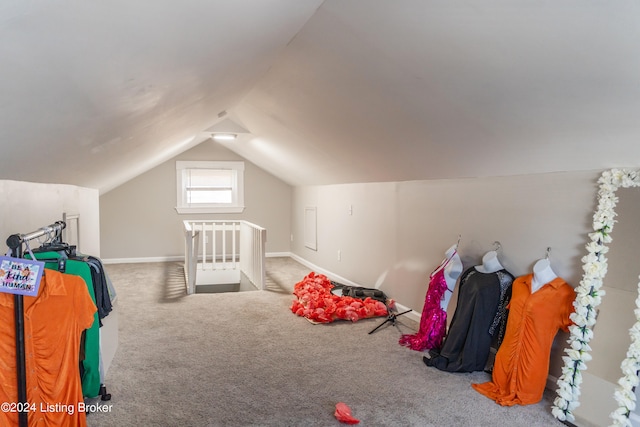 game room featuring carpet flooring and lofted ceiling