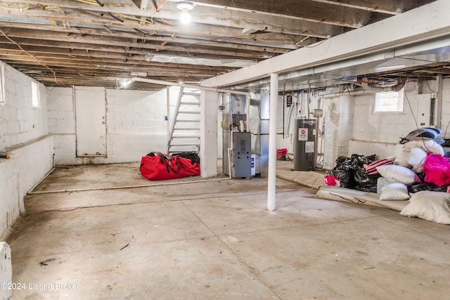 basement with water heater and heating utilities