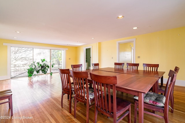 dining area with light hardwood / wood-style floors