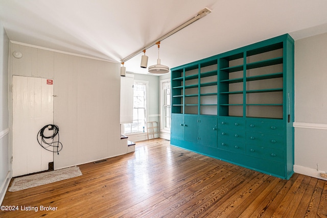 unfurnished room with dark hardwood / wood-style flooring and vaulted ceiling