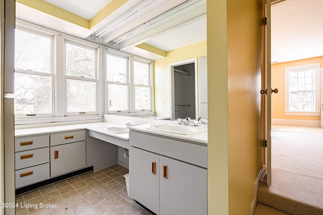 bathroom featuring tile flooring and vanity