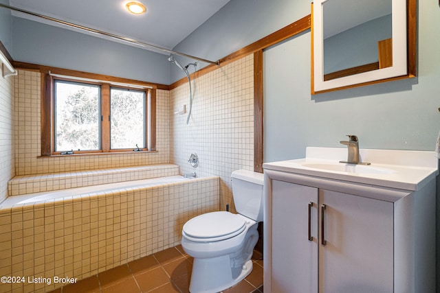 bathroom featuring toilet, vanity, and tile flooring