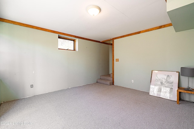 spare room with dark colored carpet