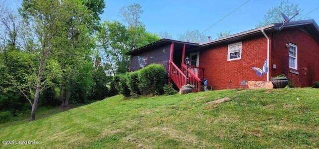 view of home's exterior featuring a lawn