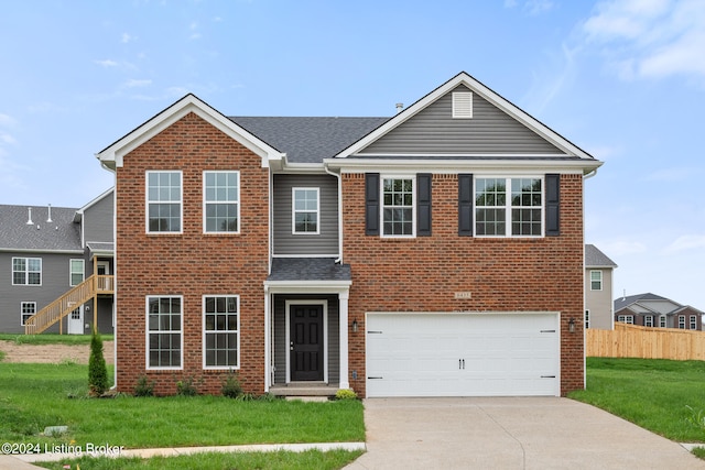 view of front facade featuring a front yard and a garage