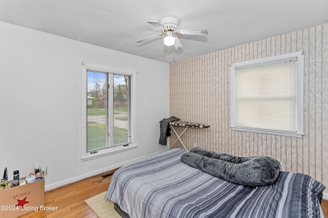 bedroom featuring light hardwood / wood-style floors and ceiling fan