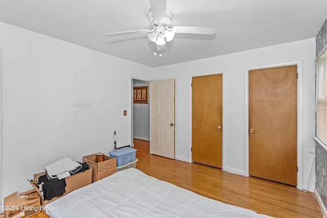 unfurnished bedroom featuring ceiling fan and light hardwood / wood-style flooring