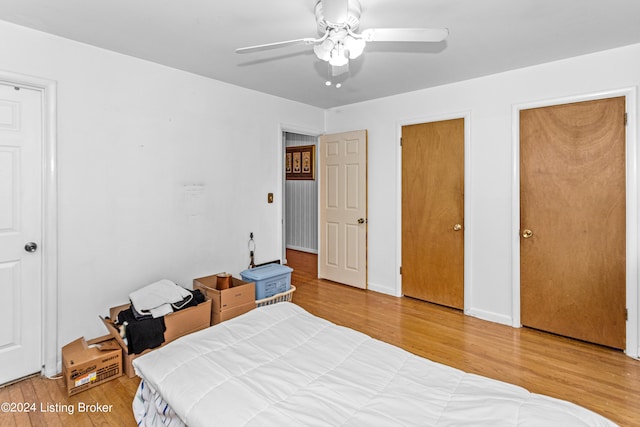 bedroom featuring ceiling fan and light hardwood / wood-style flooring