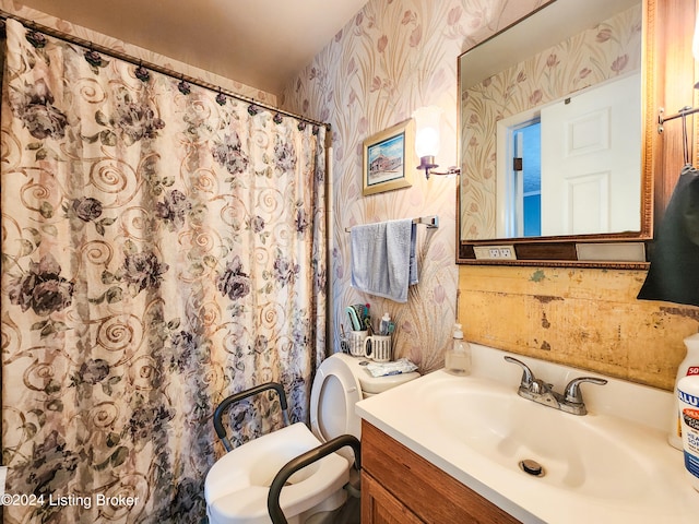 bathroom featuring vanity and toilet