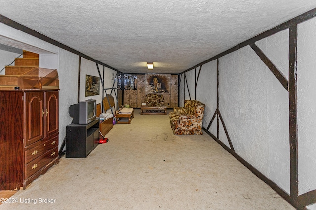 basement featuring a textured ceiling