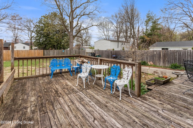 wooden terrace with a yard