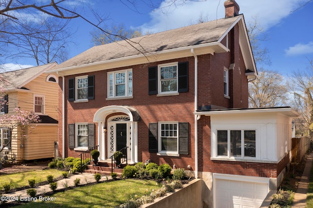 colonial home featuring a garage