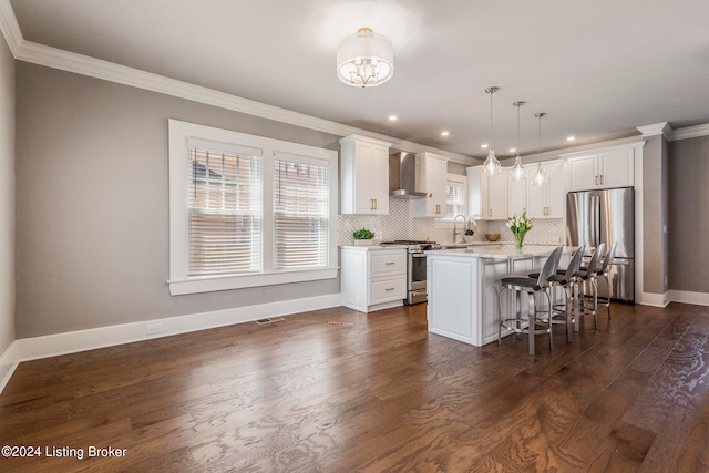 kitchen with dark wood-type flooring, white cabinetry, stainless steel appliances, a center island, and a kitchen breakfast bar