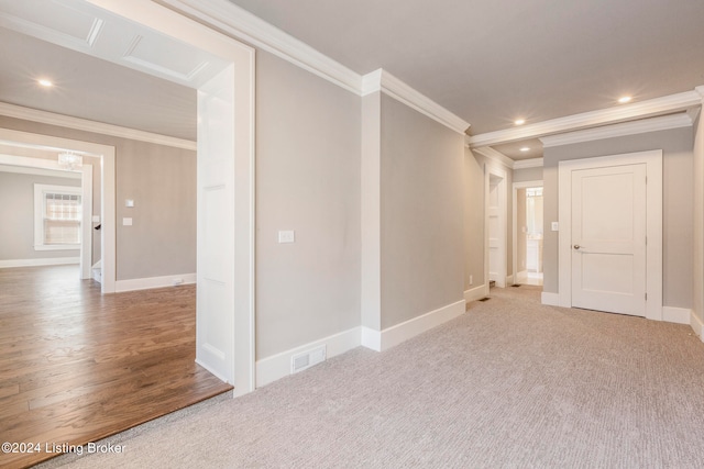 carpeted empty room featuring ornamental molding