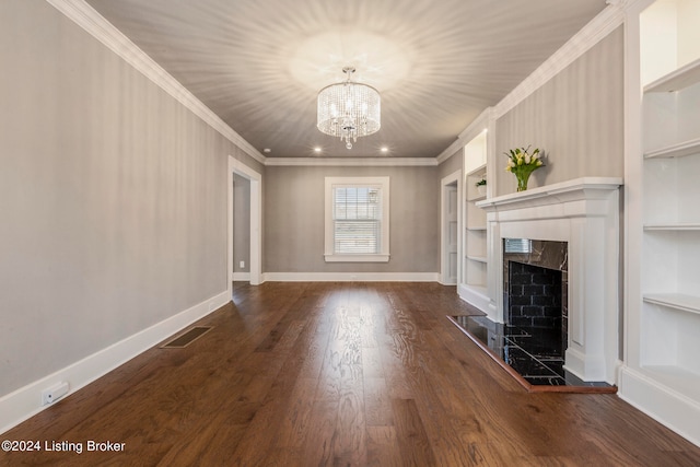 unfurnished living room featuring a chandelier, a fireplace, crown molding, and dark hardwood / wood-style flooring