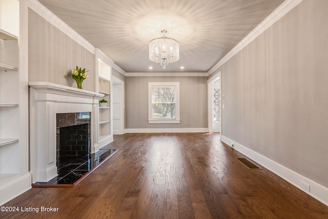 unfurnished living room with a chandelier, ornamental molding, and dark wood-type flooring