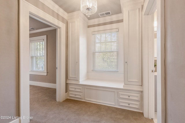 mudroom with light carpet, an inviting chandelier, and crown molding