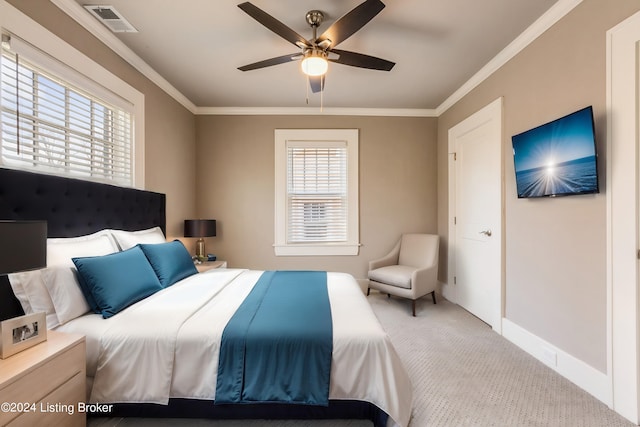 bedroom featuring ceiling fan, ornamental molding, and light carpet