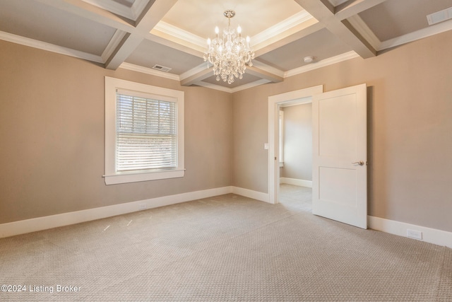 carpeted empty room featuring crown molding, beam ceiling, coffered ceiling, and a notable chandelier