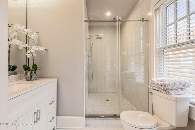 bathroom featuring tile flooring, toilet, vanity, and an enclosed shower