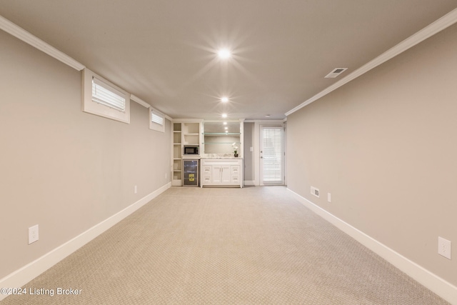 interior space with wine cooler, light carpet, and ornamental molding