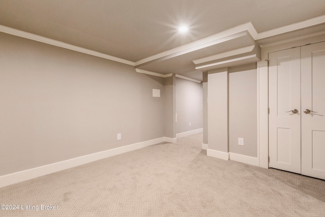 basement featuring light carpet and crown molding